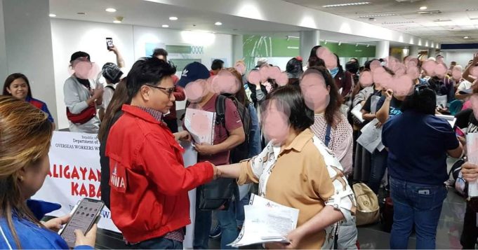 100 OFWs repatriated from Kuwait arrived at NAIA on Saturday Arnel Ignacio with OFWs at NAIA