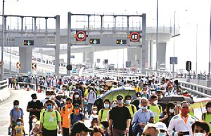 Thousands join Walk for Millions on Iconic HZMB Bridge to Commemorate The Community Chest’s 55th Anniversary 11,000 people join Walk for Millions on mega bridge_upscayl_4x