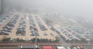 Hong Kong Battles Floods and Landslides as Heavy Rains Pound Region Cars damaged by flood in Hong Kong