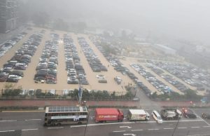 Hong Kong Battles Floods and Landslides as Heavy Rains Pound Region Cars damaged by flood in Hong Kong