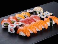 Hong Kong Tightens Food Imports from Japan over Fukushima Water Discharge an-elegant-sushi-set-displayed-on-a-sleek-black-plate