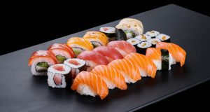 Hong Kong Tightens Food Imports from Japan over Fukushima Water Discharge an-elegant-sushi-set-displayed-on-a-sleek-black-plate