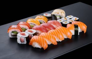 Hong Kong Tightens Food Imports from Japan over Fukushima Water Discharge an-elegant-sushi-set-displayed-on-a-sleek-black-plate