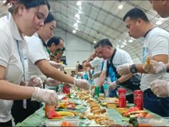Filipino Seafarers Honored as Philippines Celebrates World Maritime Week Filipino seafarers partake in a boodle fight prepared by the Department of Migrant Workers