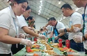 Filipino Seafarers Honored as Philippines Celebrates World Maritime Week Filipino seafarers partake in a boodle fight prepared by the Department of Migrant Workers