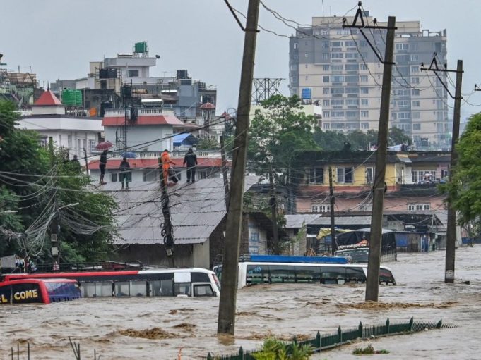 Devastating Floods and Landslides Claim 66 Lives in Nepal Survivors were seen standing on top of building