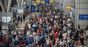 Hong Kong Gears Up for Golden Week Visitor Influx tourist from China at the Hong Kong airport during Golden Week holiday v2