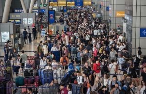 Hong Kong Gears Up for Golden Week Visitor Influx tourist from China at the Hong Kong airport during Golden Week holiday v2