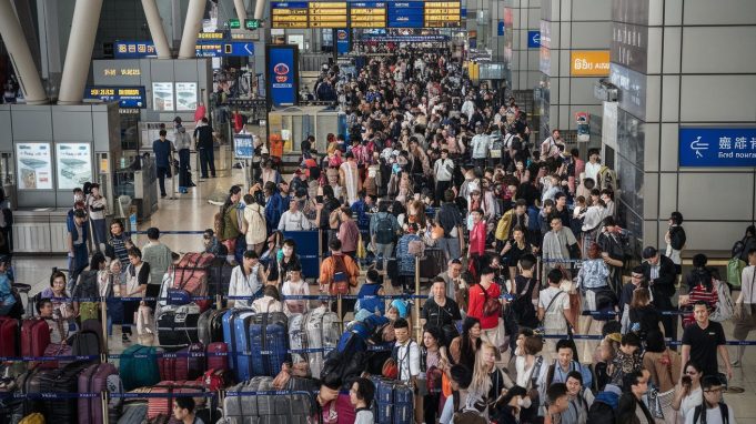 Hong Kong Gears Up for Golden Week Visitor Influx tourist from China at the Hong Kong airport during Golden Week holiday v2