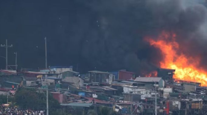 Massive Blaze Destroys Hundreds of Homes in Manila Slum Fire rips through slum area in Philippine capital