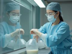Hong Kong Launches Breast Milk Bank to Support Premature, Sick Newborns a_hong_kong_nurse_wearing_surgical_mask_pours_breast_milk_to_a_container