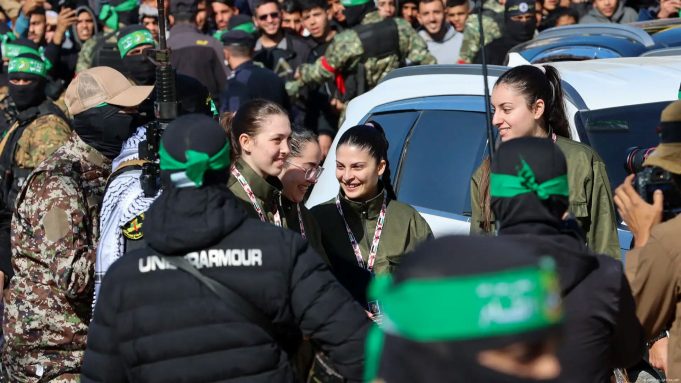 Hostage-Prisoner Swap Unfolds Amidst Gaza Ceasefire Hamas fighters escort four Israeli hostages