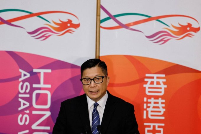 Thai Officials Pledge Swift Action to Rescue Hong Kong Workers in Recruitment Trap Hong Kong's Secretary for Security Chris Tang speaks to media over the landmark national security trial, in Hong Kong