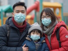 Cold Snap Grips Hong Kong as Temperatures Plunge to 12°C, Health Warnings Issued a_hong_kong_family_wearing_cold_weather_clothes_and_medical_masks_background_childrens_playground