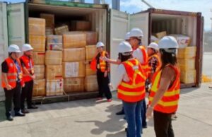 BOC and DMW Team Up to Deliver 2,954 Lost Balikbayan Boxes to OFW Kin DMW personnel receive the over 2,000 abandoned and unclaimed balikbayan boxes