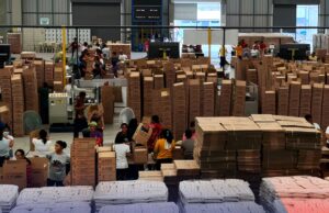PH Government Readies Aid Preparation As Phivolcs Warns of Possible Taal Eruption DSWD Volunteers help repack family food packs