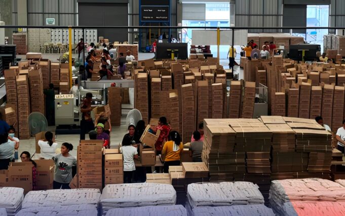 PH Government Readies Aid Preparation As Phivolcs Warns of Possible Taal Eruption DSWD Volunteers help repack family food packs