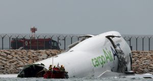 Two Killed in Hong Kong Airport Crash After Cargo Plane Veers Off Runway Two Killed in Hong Kong Airport Crash After Cargo Plane Veers Off Runway