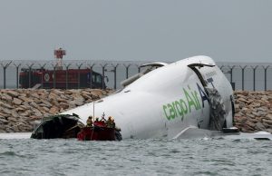 Two Killed in Hong Kong Airport Crash After Cargo Plane Veers Off Runway Two Killed in Hong Kong Airport Crash After Cargo Plane Veers Off Runway