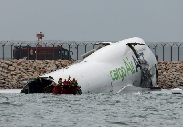 Two Killed in Hong Kong Airport Crash After Cargo Plane Veers Off Runway Two Killed in Hong Kong Airport Crash After Cargo Plane Veers Off Runway
