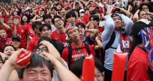 Iran, South Korea Crash Out as World Cup Enters Knockout Stage South Korea fans images after Crash Out of World Cup