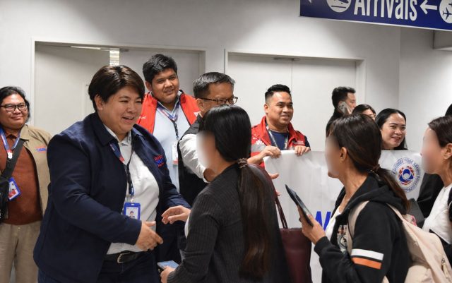 OWWA Administrator Patricia Yvonne Caunan welcomes returning overseas Filipino workers